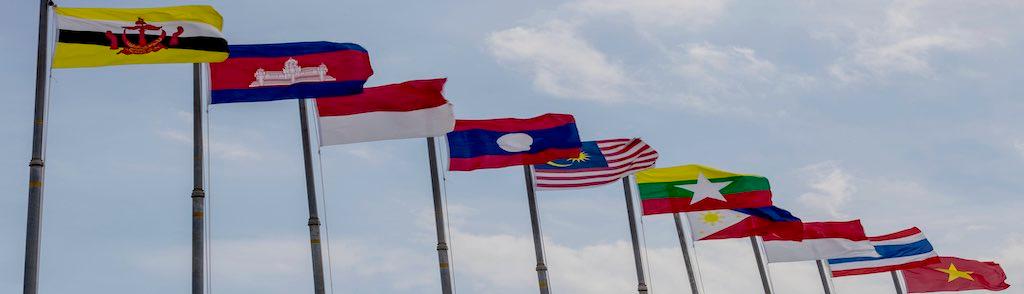 National flags of countries who are member of AEC (ASEAN economic community) on blue sky background