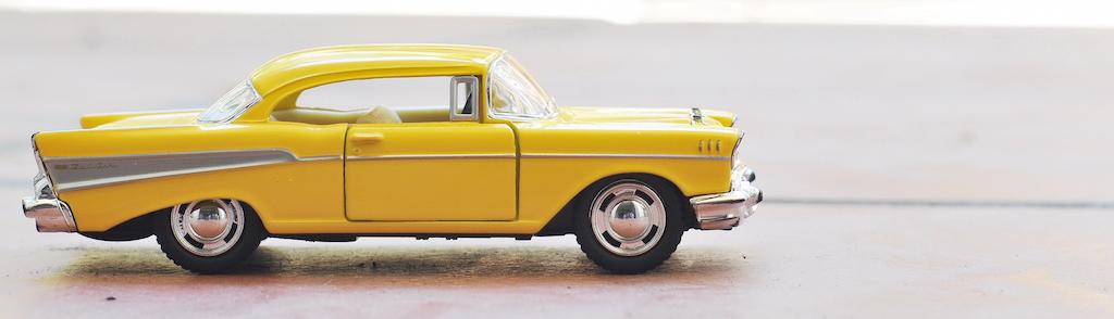 Yellow toy chevy Impala
