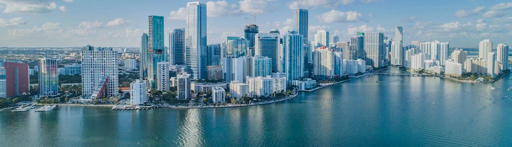 An aerial shot of Brickell Key, with downtown cityscape.